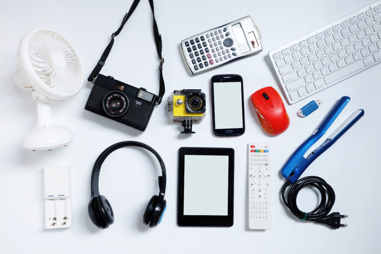 E-book reader with cell phones, camera, keyboard, mouse and flash drives USB. on white background, Used modern gadgets or electronic equipment for daily use concept, Top view.
